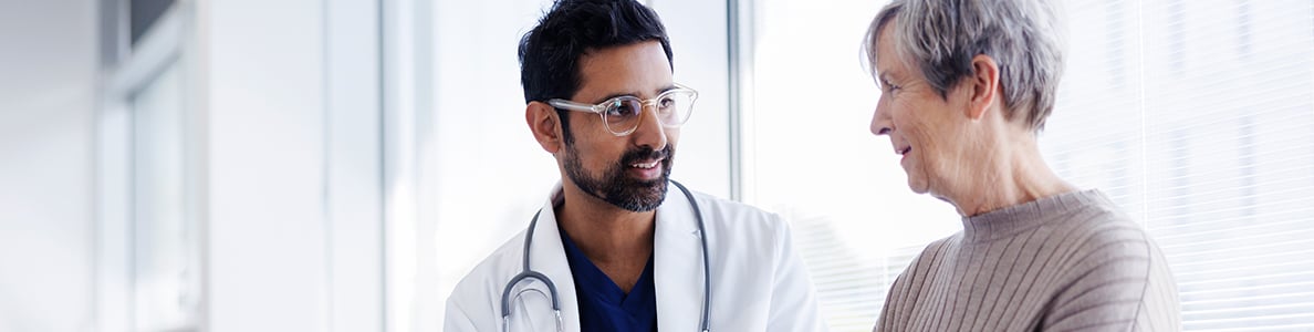A doctor speaks to a patient.