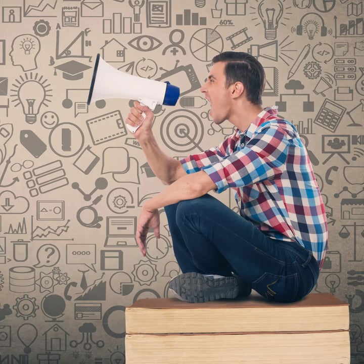 A marketing professional passionately speaks into a microphone, energizing the audience with his enthusiasm.