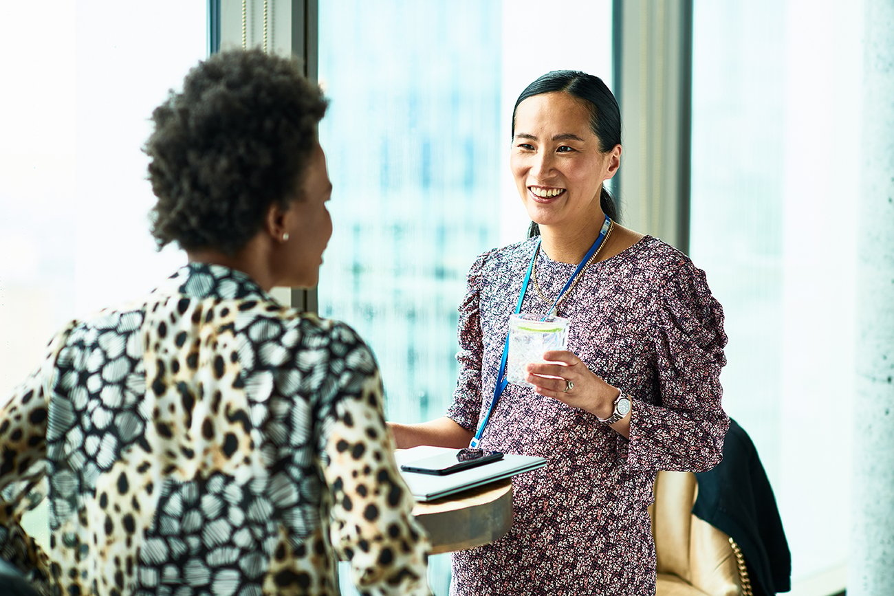 Two professional women networking.