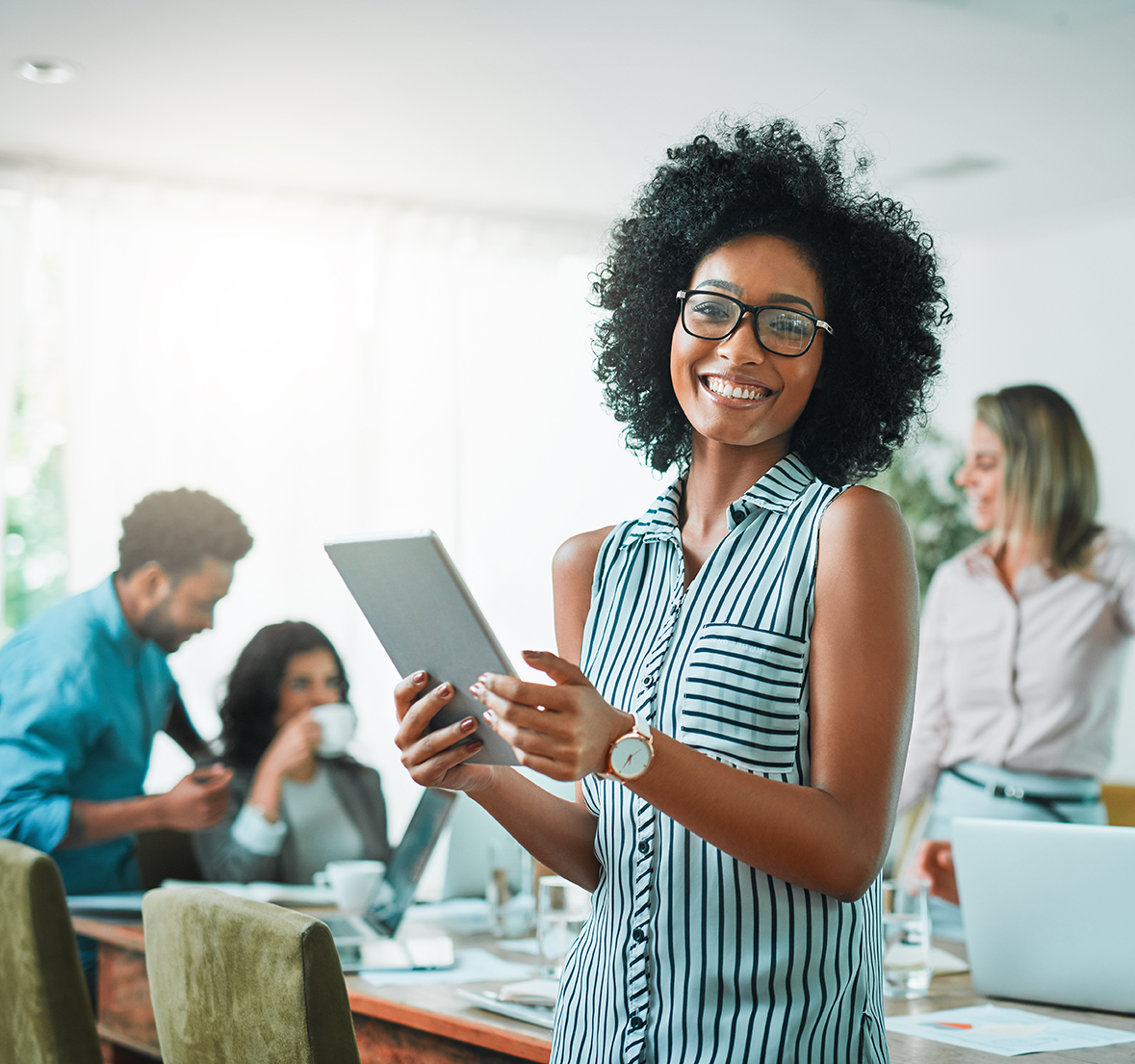 Business financing smiling woman holding a tablet