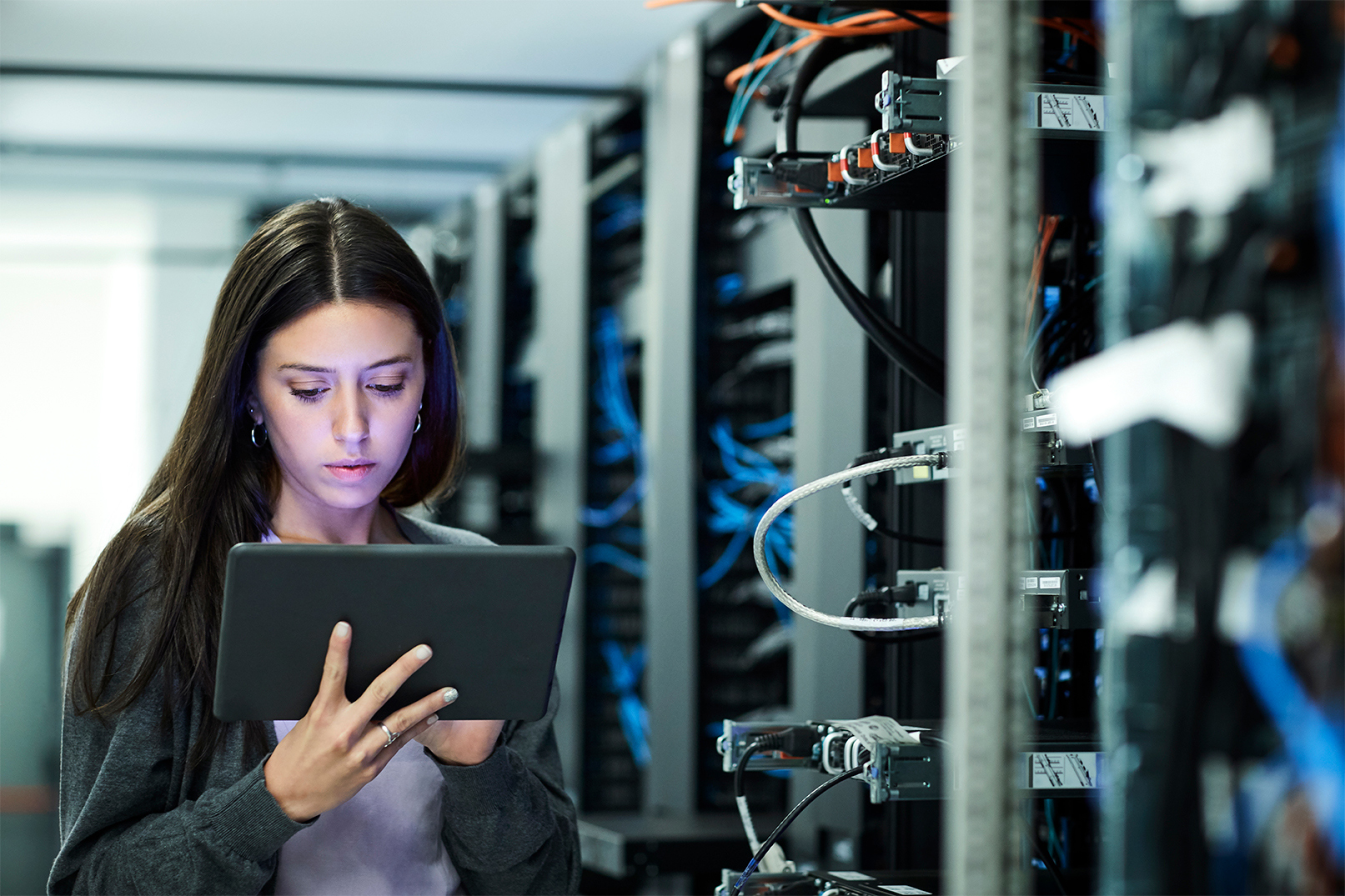 A Cubeler member in IT room checking her data on a tablet