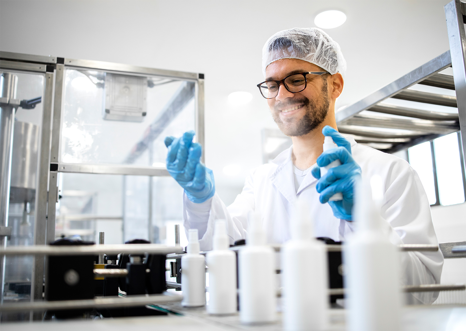 A Cubeler member in a lab coat working in a laboratory